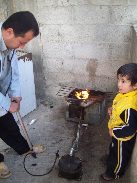 Medic Hassan with his amazing stove & son Fawzi