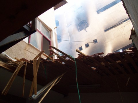 Roof destroyed by strike, fire continues in Red Crescent Operations next door