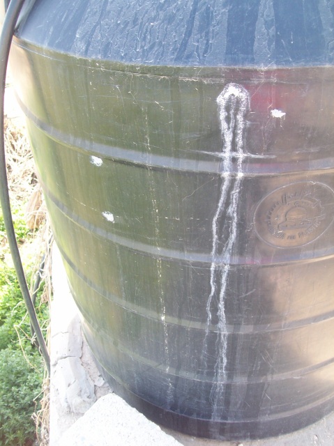 Bullet holes to water tank from May 08 since sealed up